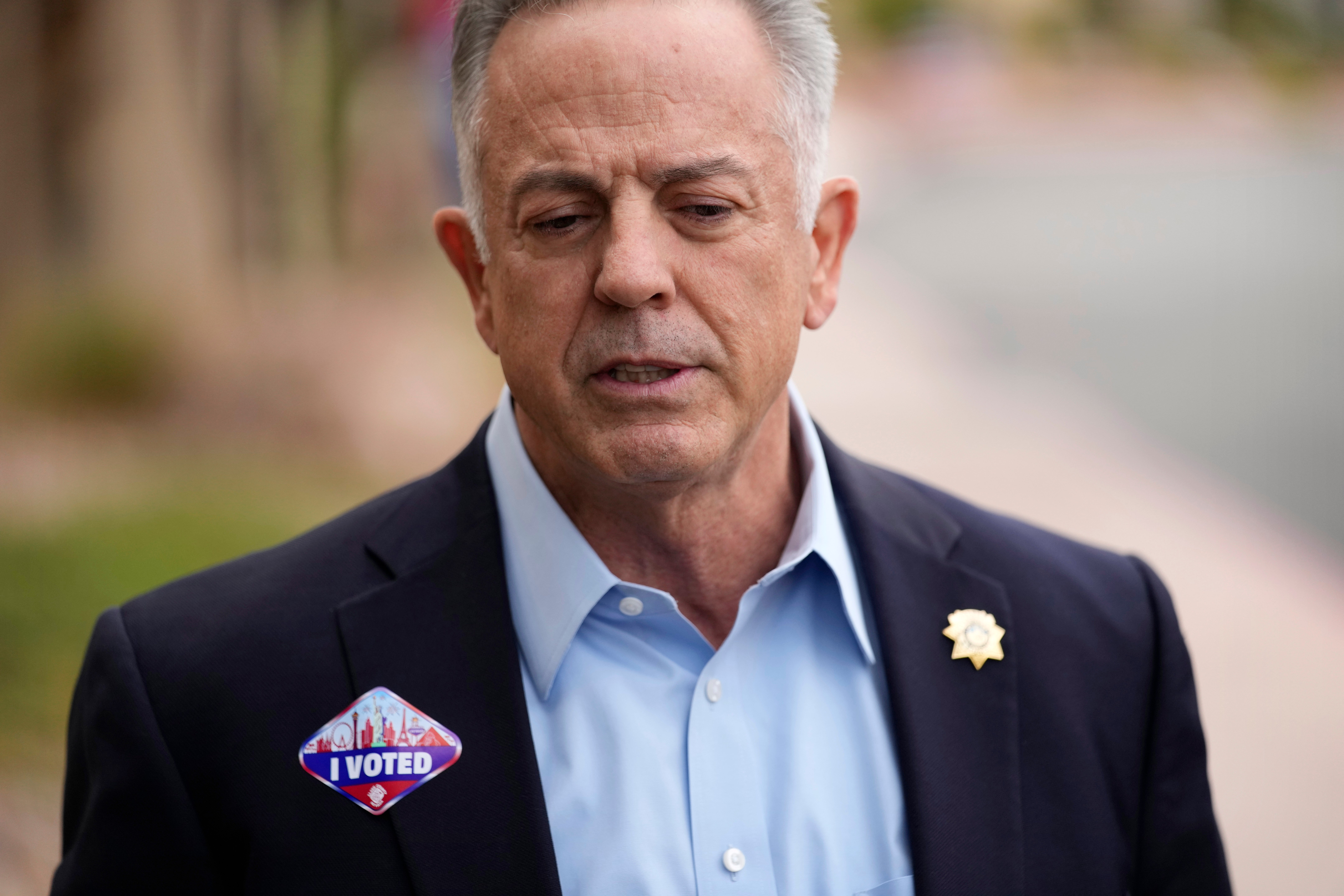 FILE - Joe Lombardo, Clark County sheriff and Republican candidate for Nevada governor, speaks with the media after voting, Nov. 3, 2022, in Las Vegas. In late September 2023, Lombardo filed a lawsuit challenging the state ethics commission’s authority to censure and fine the former Clark County sheriff for using his publicly issued sheriff’s badge during his 2022 gubernatorial campaign. (AP Photo/John Locher, File)