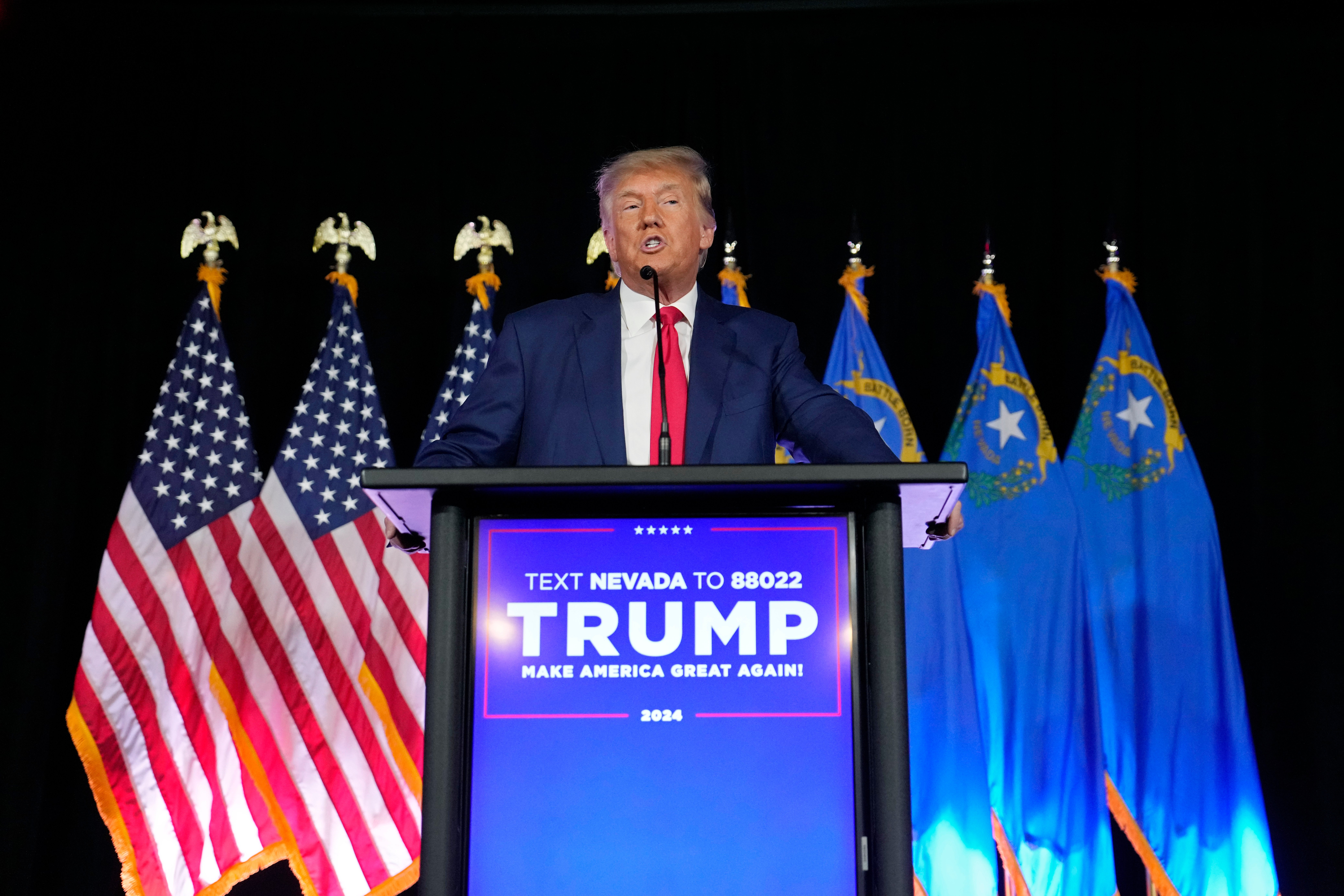 FILE - Former President Donald Trump speaks at a campaign event, July 8, 2023, in Las Vegas. Six Republicans who have been indicted on charges that they submitted paperwork to Congress falsely declaring Donald Trump the winner of the Western swing state in 2020 are scheduled to make their initial court appearances Monday. (AP Photo/John Locher, FIle)
