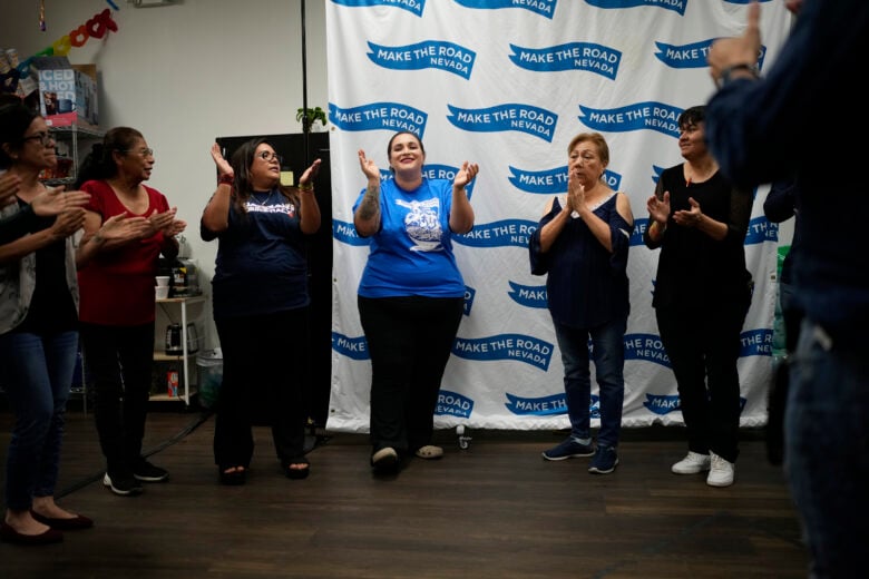 Erika Marquez, center, leads a meeting at the nonprofit Make the Road Nevada, where she works as the immigration and justice organizer, Thursday, Sept. 12, 2024, in Las Vegas. Marquez is a recipient of an Obama administration amnesty for immigrants brought to the U.S. illegally as children. (AP Photo/John Locher)