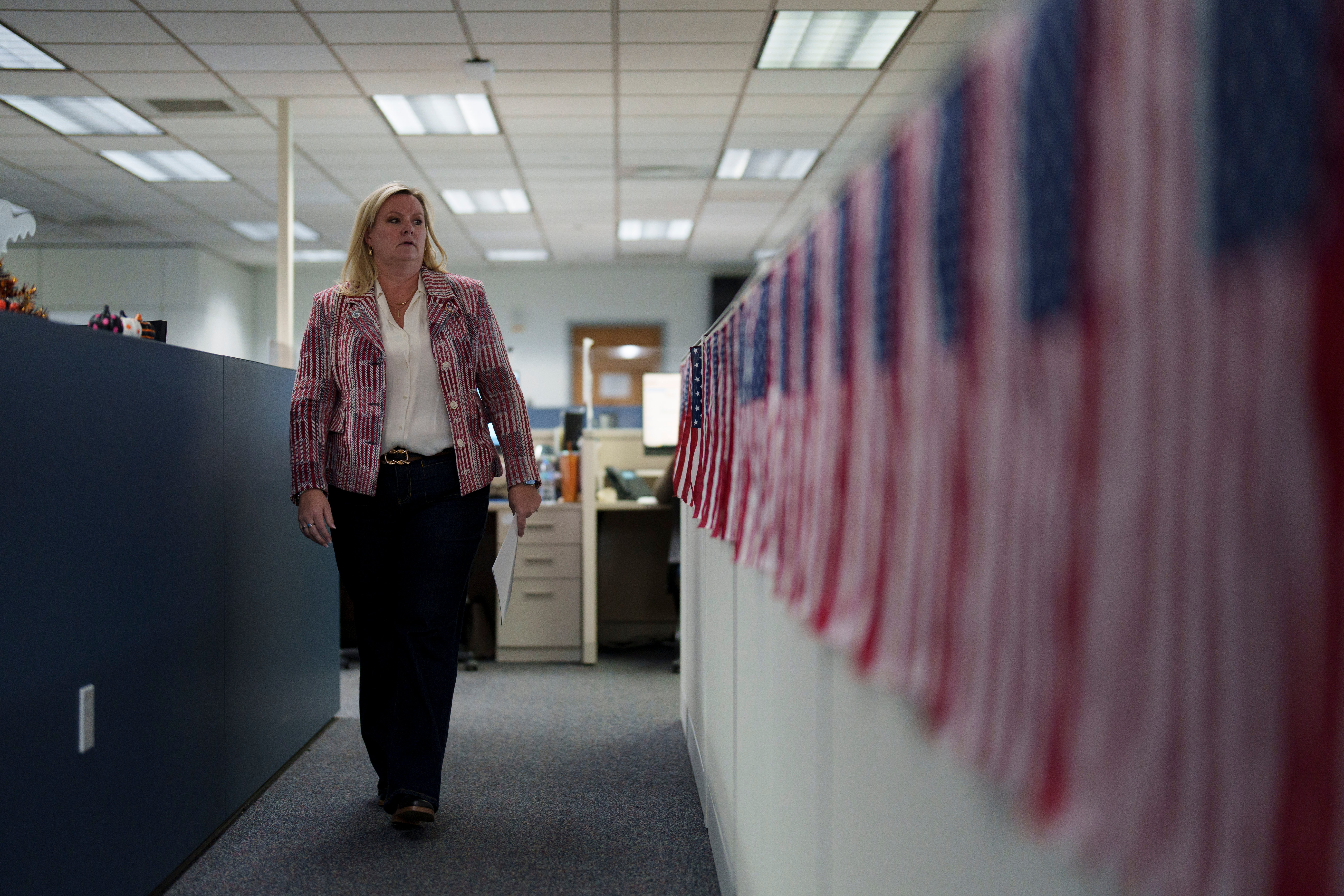 Cari-Ann Burgess, interim Registrar of Voters for Washoe County, Nev., walks through the office Friday, Sept. 20, 2024, in Reno, Nev. (AP Photo/John Locher)