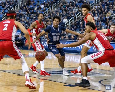 Grant Sherfield is surrounded by the enemy in Nevada's 62-54 home loss vs UNLV on February 22, 2022 at Lawlor Events Center (Michael Smyth / This is Reno)