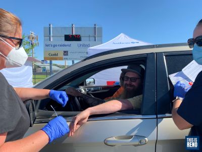 Anthem Blue Cross and Blue Shield staff collect samples at a COVID-19 drive-through testing site at Reed High School June 23. Image: Lucia Starbuck