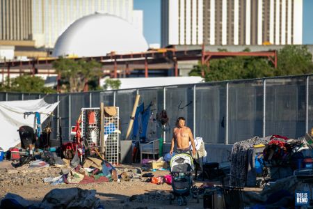 People living in a homeless camp in downtown Reno had to vacate the area early June 3 as RPD moved in to clean the area. Image: Eric Marks