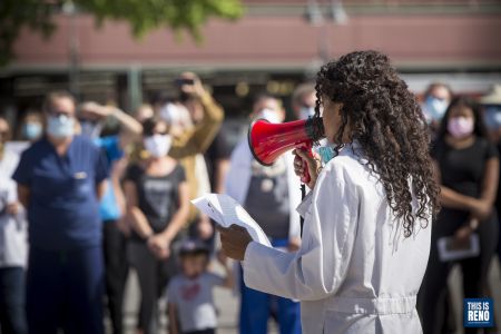 Dr. LaDawn Talbott, a plastic surgeon, delivers a speech calling for law enforcement to protect and serve the community just as doctors like her do--without discrimination. Image: Trevor Bexon