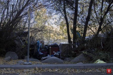 Garbage from a nearby homeless encampment is seen along the Truckee River.