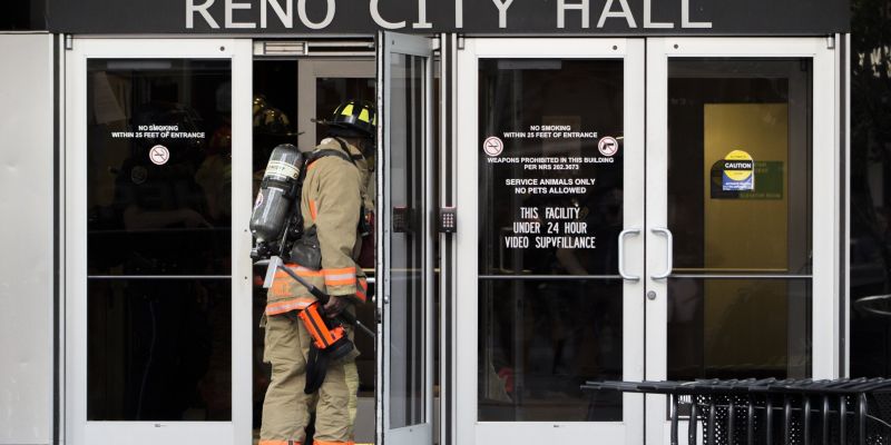 Reno Fire Department arrives to out out fires set at City Hall. Image: Trevor Bexon