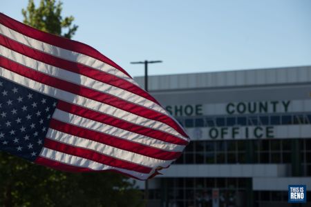 A U.S. flag flies upside down during a protest against ICE outside the Washoe County Jail July 11, 2020. Image: Trevor Bexon
