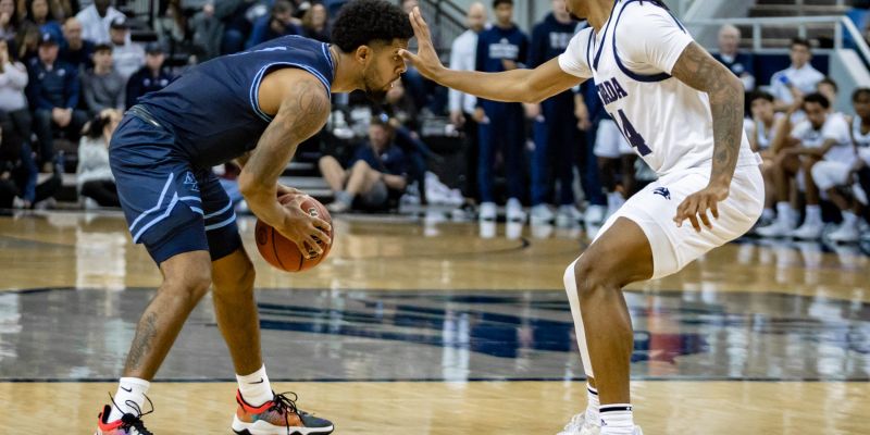 Nevada’s Tre Coleman does his best to slow down San Diego’s Jase Townsend, who led the Toreros with 18 points in their win over the Wolf Pack 75-68 on Nov. 12, 2021 at Lawlor Events Center in Reno, Nev. (Mike Smyth / This is Reno)