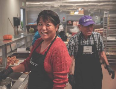 Susy Tsai and Hank Dever work in the Warming Center's kitchen.