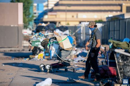 People living in a homeless camp in downtown Reno had to vacate the area early June 3 as RPD moved in to clean the area. Image: Eric Marks