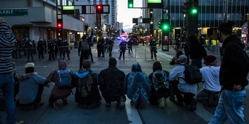 Protesters and police clash in downtown Reno. Image: Ty O'Neil
