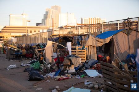 Reno Police launched an early morning cleanup of a homeless encampment in downtown Reno. Image: Isaac Hoops
