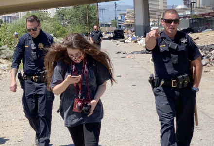 Reno Police officers prevented journalists from entering a homeless camp clean-up site. Officers demanded we leave the scene. Image: Bob Conrad.