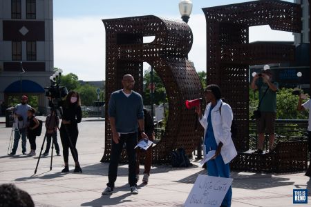 Oscar Delgado (left) and Dr. Bayo Curry-Winchell (right) address the crowd before they lead a kneel in honor of George Floyd, a black man killed by police on May 25. Image: Bianca Wright