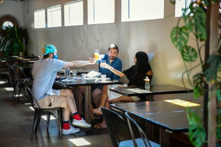 Midtown Eats customers enjoy an afternoon meal and some drinks after the restaurant opened for business May 9, 2020 during the Phase 1 reopening of Reno.