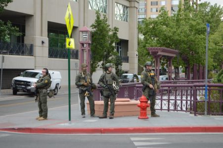 Sheriff's deputies monitor activity in downtown Reno after a 5:30 p.m. curfew was established following a night of riots.