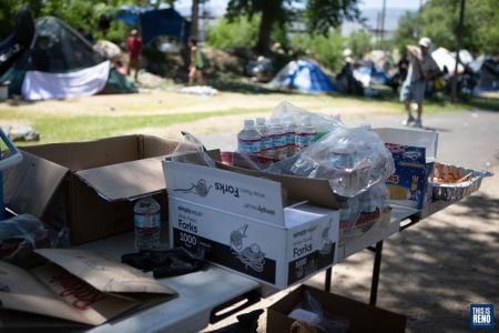 People displaced from a downtown Reno homeless camp had a picnic lunch at Brodhead Memorial Park. Image: Isaac Hoops